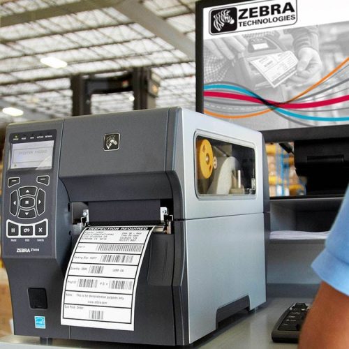 Zebra printer in focus in packing warehouse